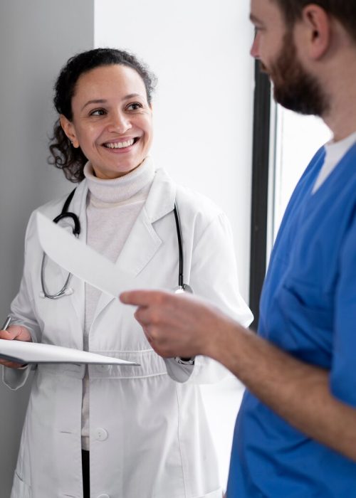 smiley-nurse-doctor-chatting_23-2149309995